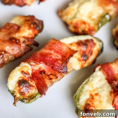 Crispy Keto Air Fryer Bacon Jalapeño Poppers 8 Air Fryer Bacon Wrapped Jalapeno Poppers - final dish on a plate