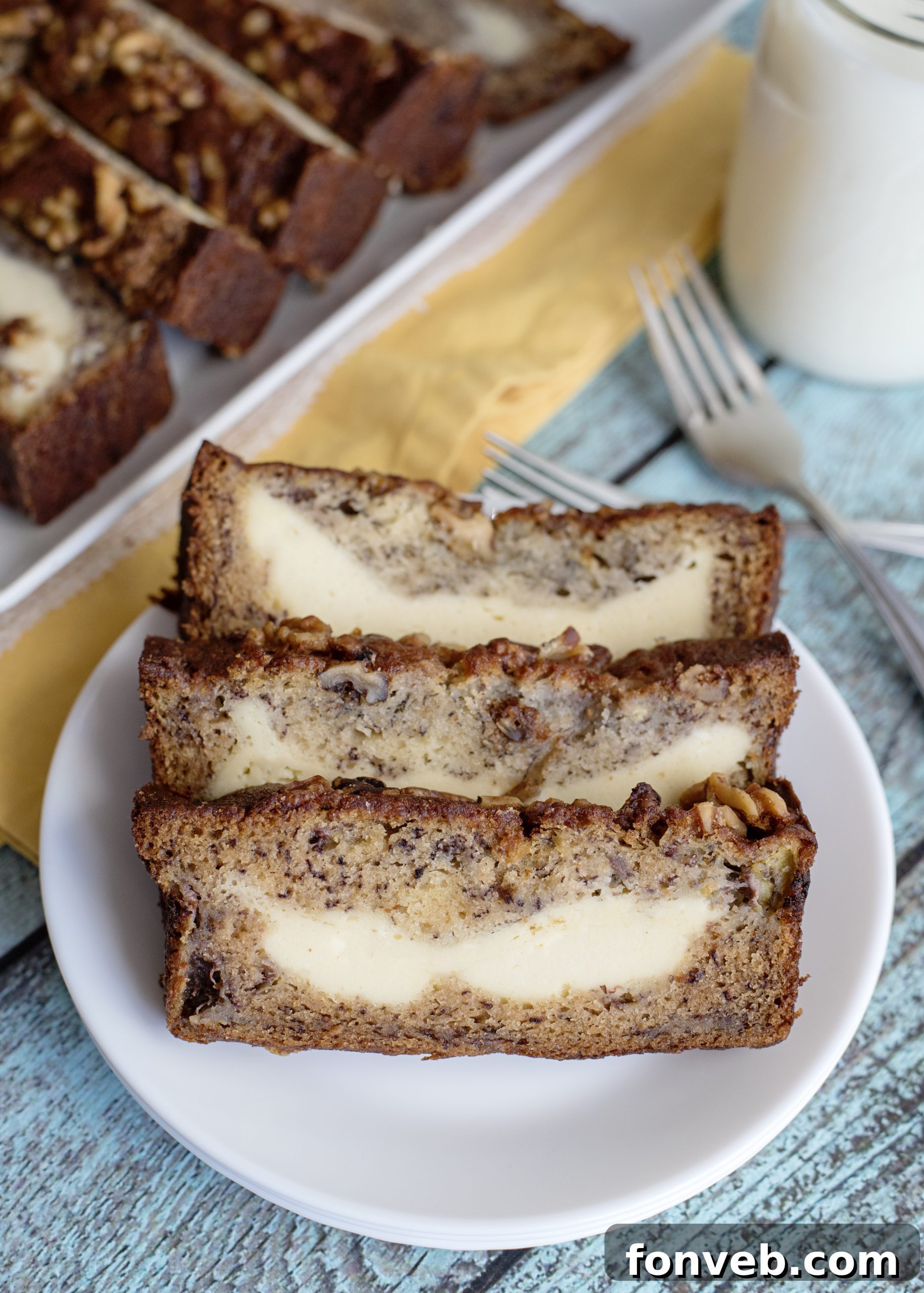 A full loaf of Cream Cheese Banana Bread on a cooling rack.