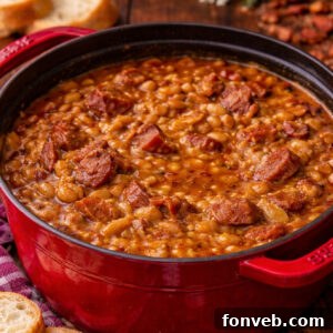 Signature Smoked Sausage Baked Beans 13 Ultimate Baked Beans with Smoked Sausage in a red pot