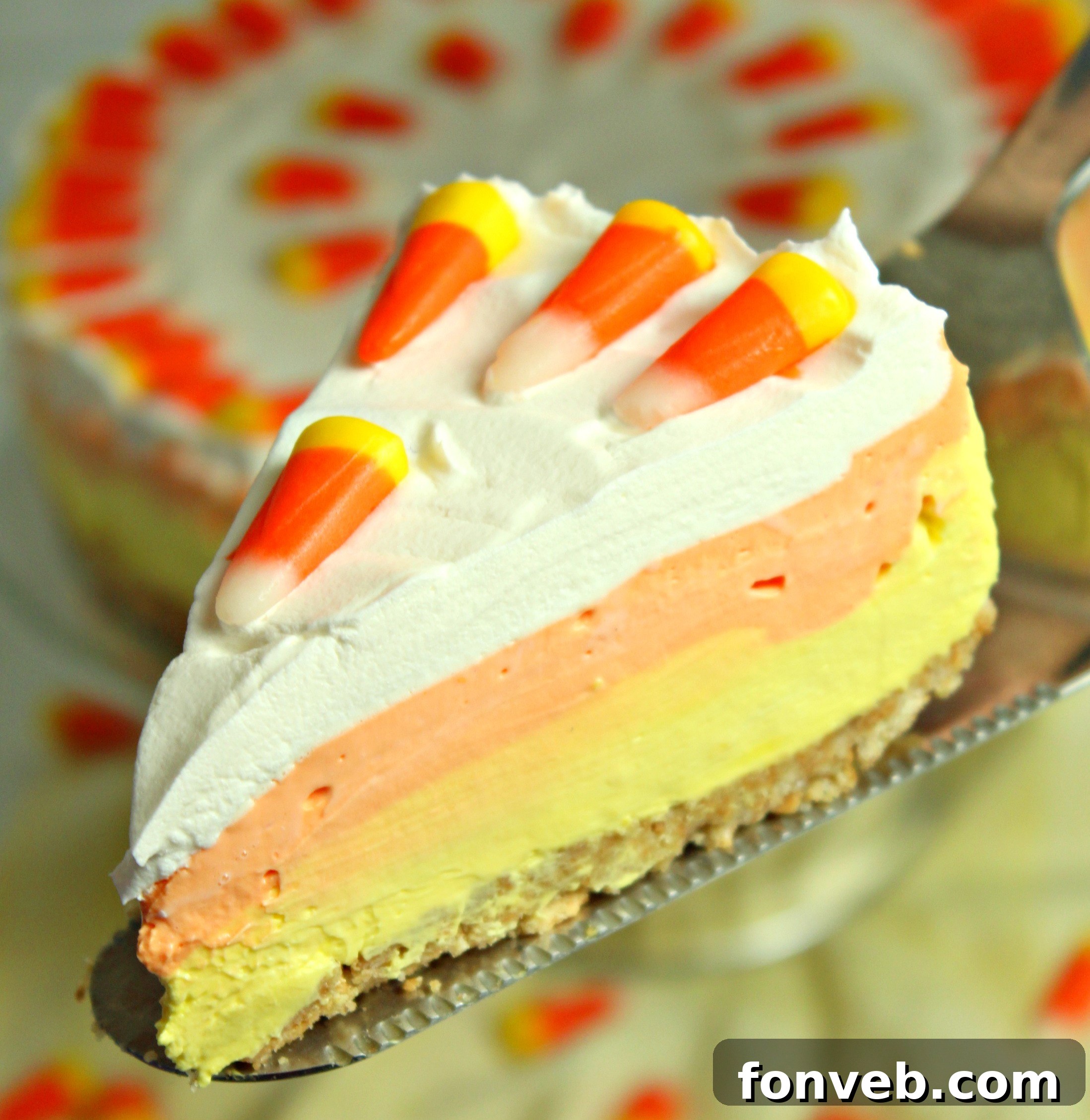 Effortless Autumn Candy Corn Cheesecake 2 Vibrantly layered No Bake Candy Corn Cheesecake, perfectly capturing fall colors.