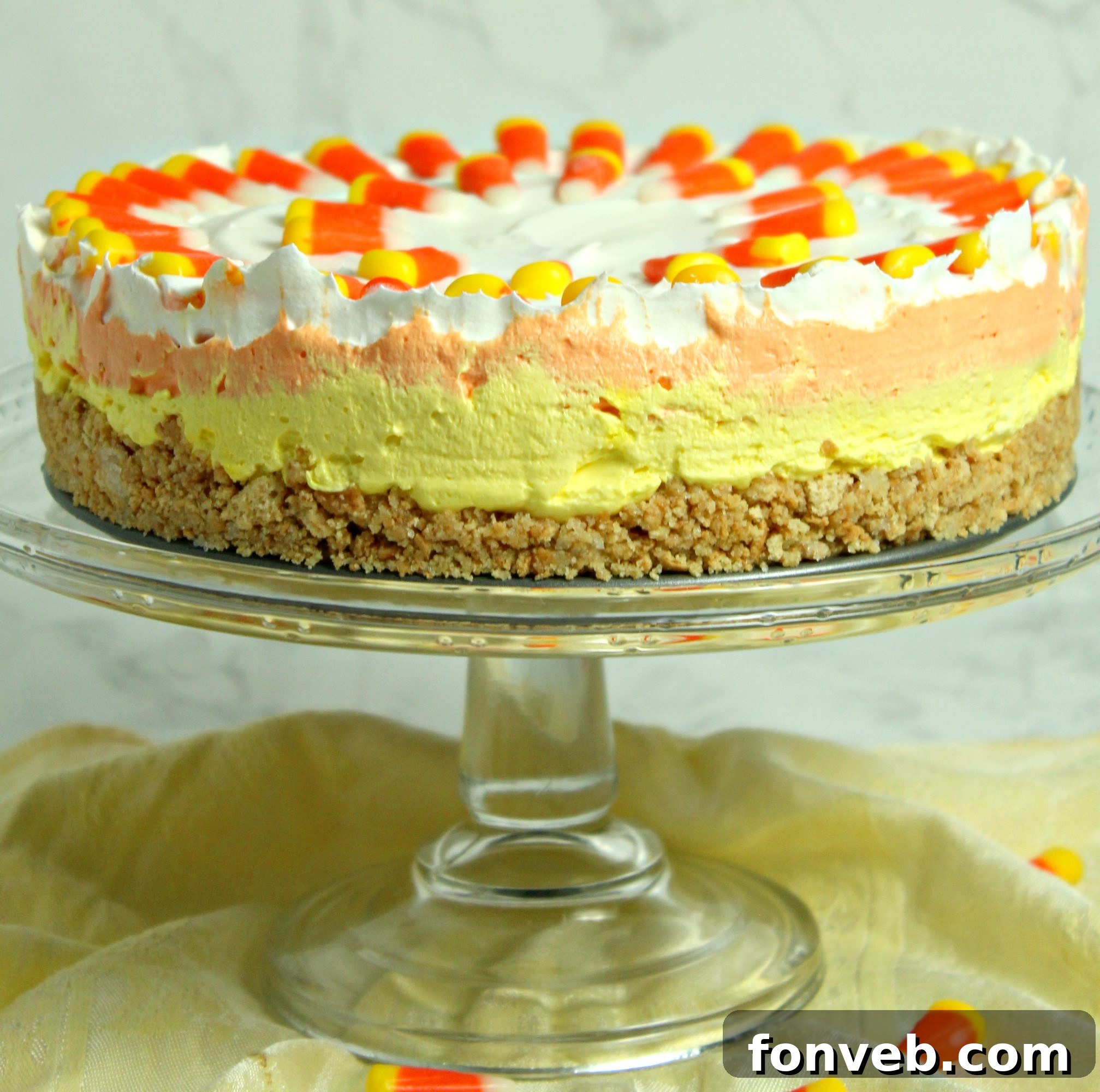 Effortless Autumn Candy Corn Cheesecake 3 Close-up of the smooth, creamy layers of the No Bake Candy Corn Cheesecake.