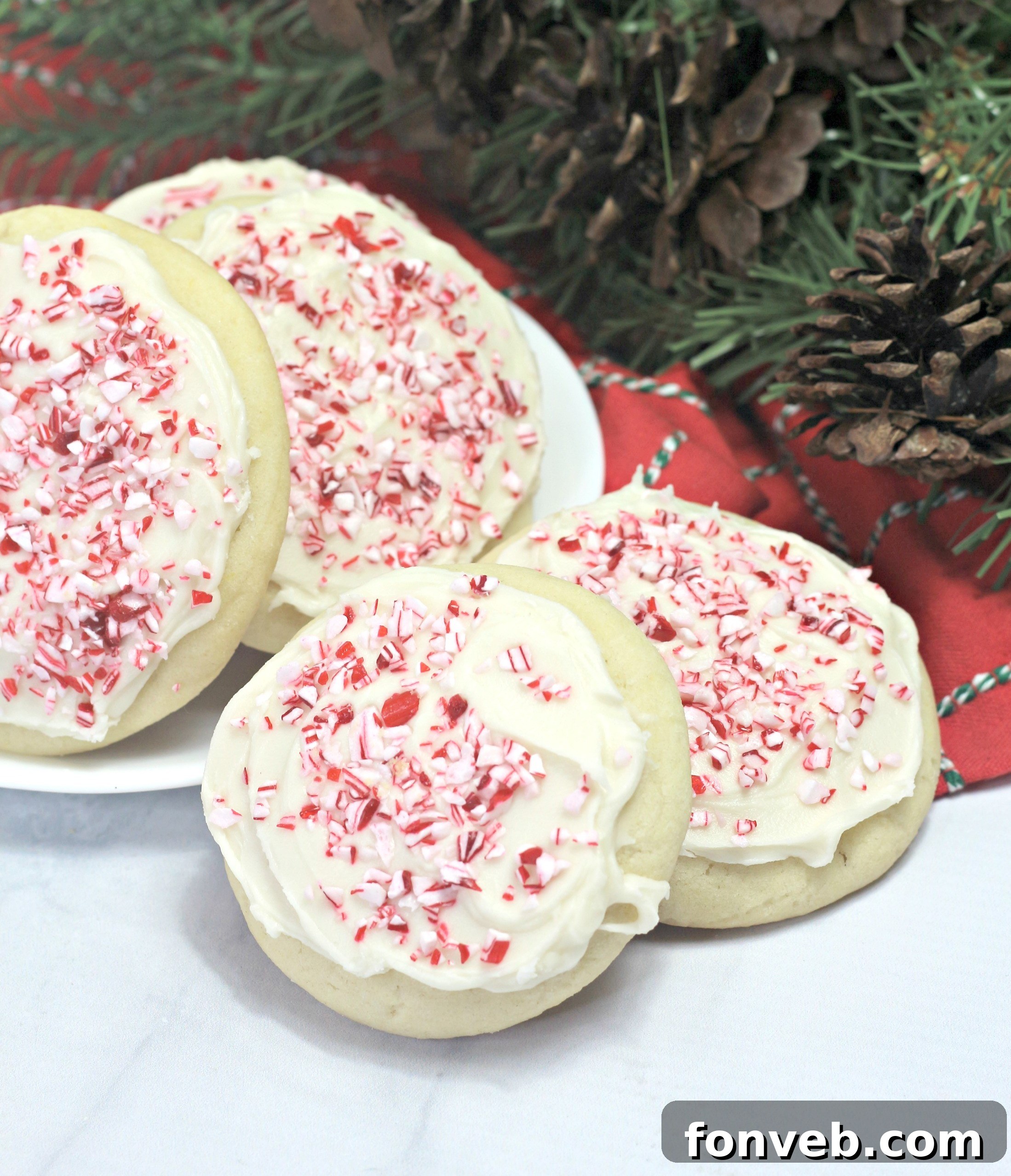 An array of frosted and decorated Amish Sugar Cookies presented on a clean white surface, highlighting their classic appeal and soft texture, ideal for sharing.