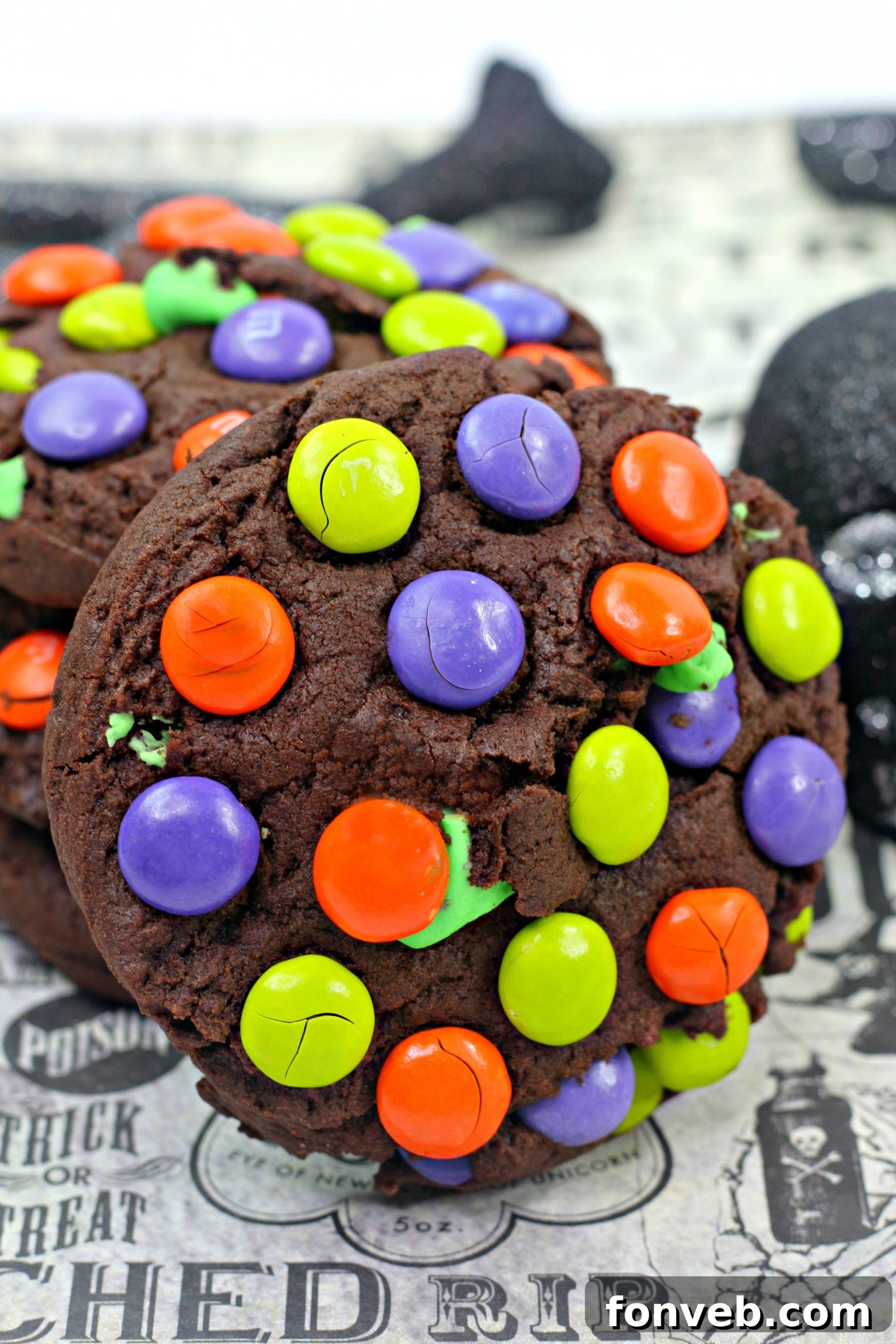 Delicious Monster Mash Chocolate Cookies piled high, showcasing their rich, dark chocolate color and vibrant M&M candies.