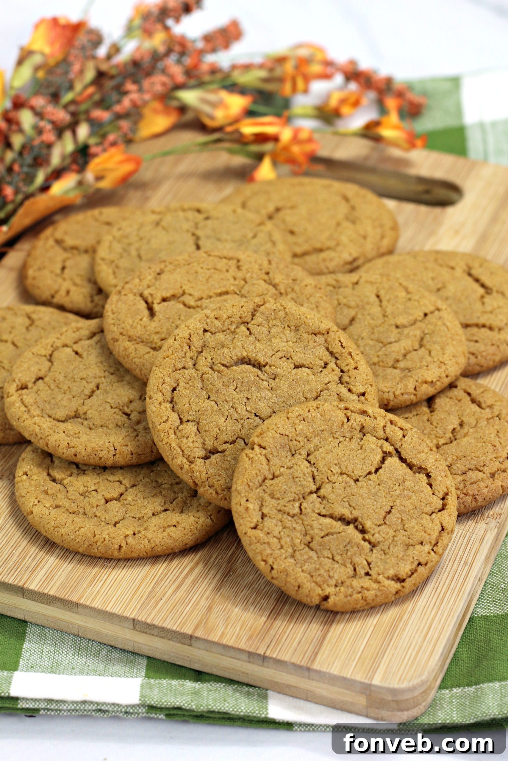 Close-up of baked Chewy Pumpkin Gingersnap Cookies with cracks on top